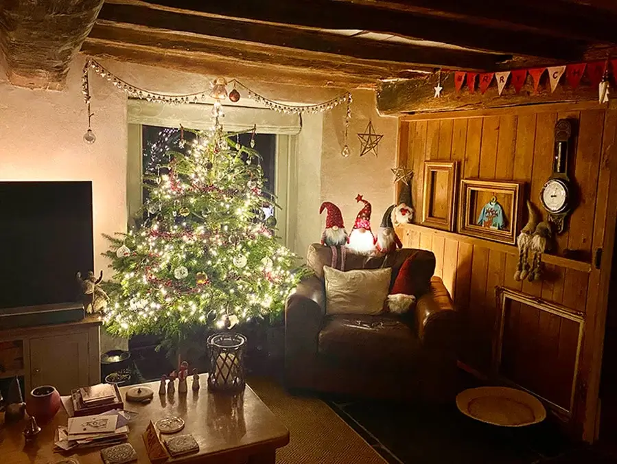 Christmas in our Welsh cottage living room Melanie and Nicholas's inviting living room decorated for Christmas 2021 in their cozy Welsh cottage.