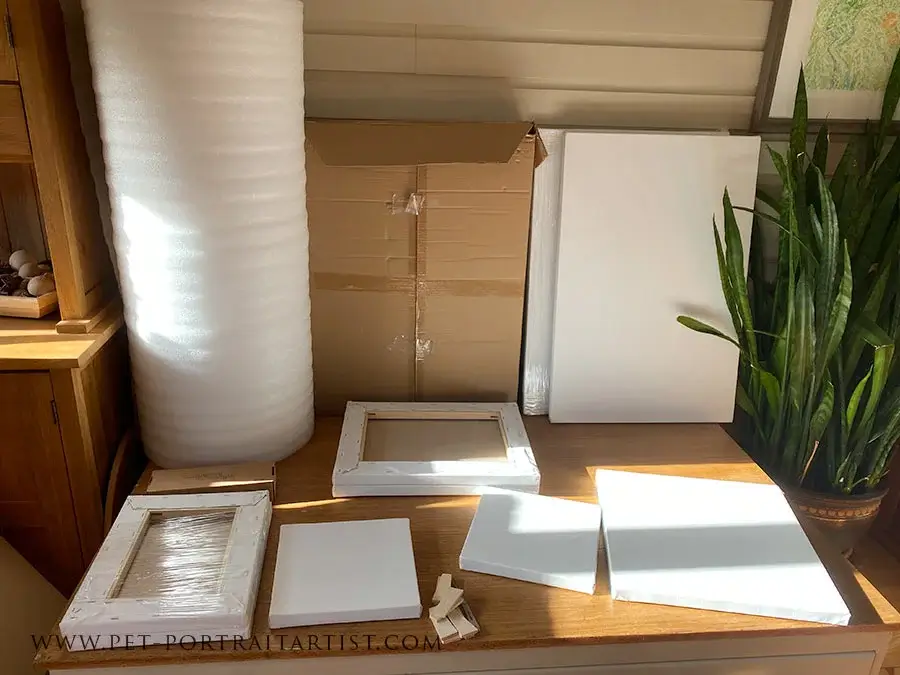 New Canvases Delivered to the Studio for Commissions A fresh delivery of multiple custom-sized canvases stacked in the studio, indicating new pet portrait commissions are ready to begin.